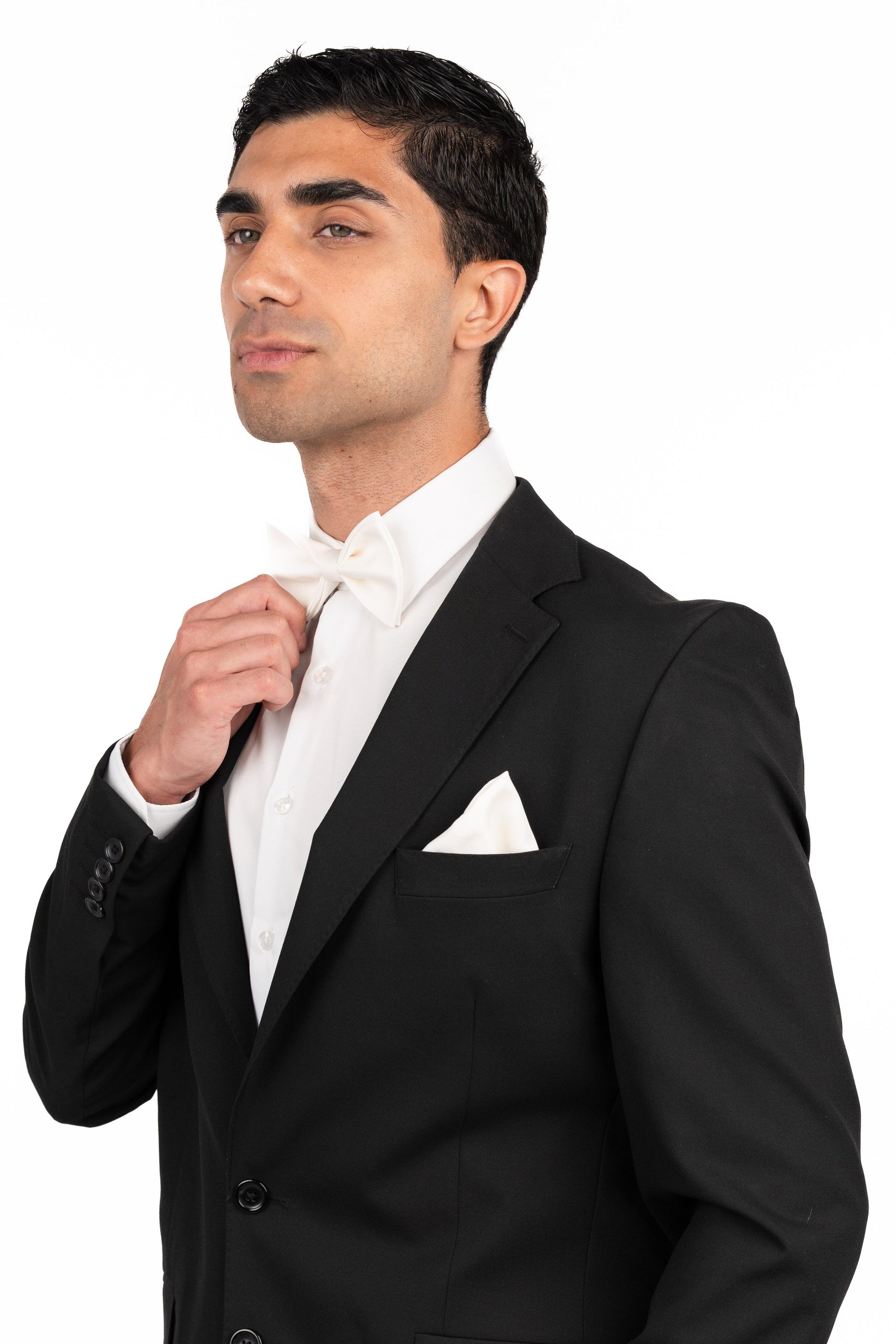 Man wearing a black suit and white shirt on a white background