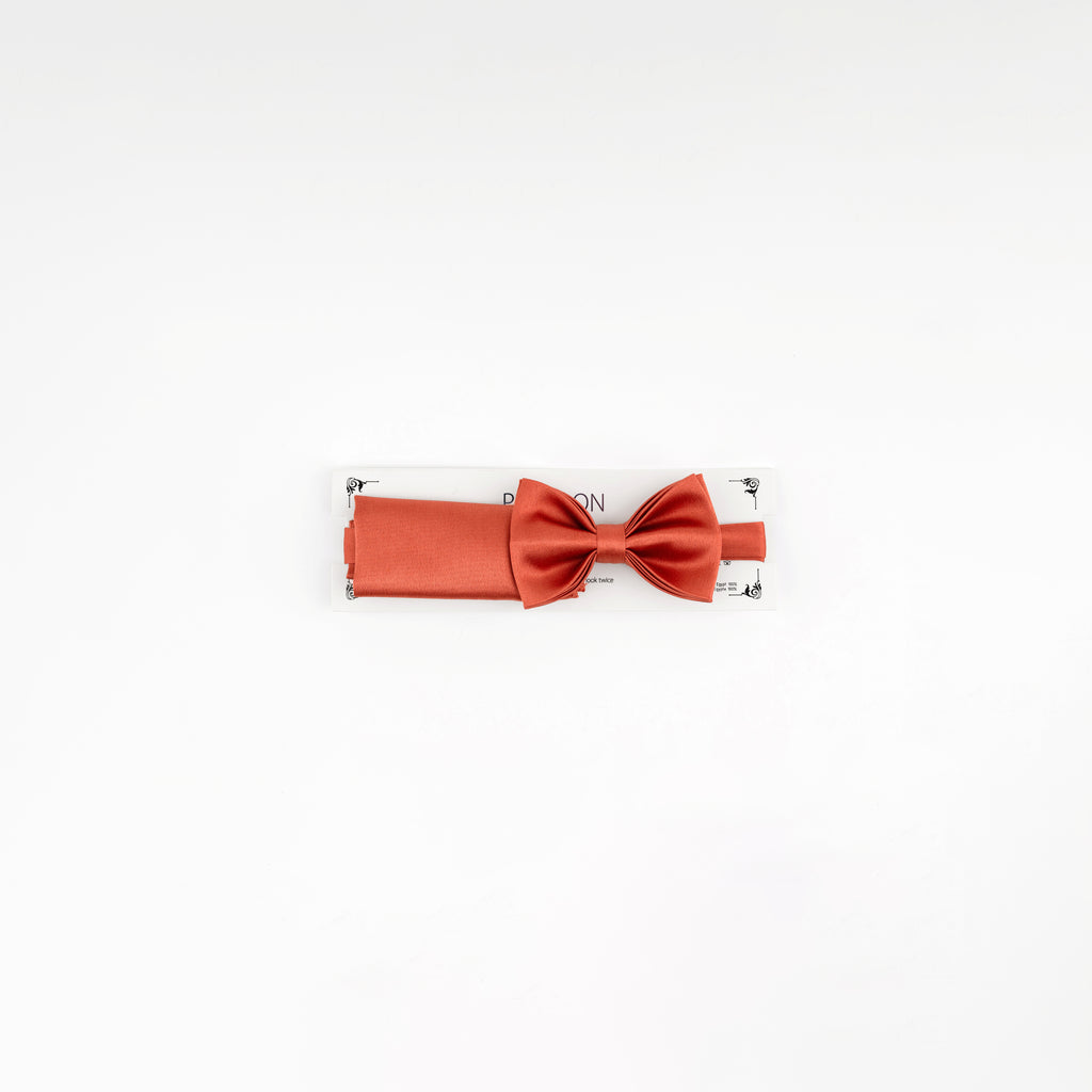 Orange bow tie on a white background