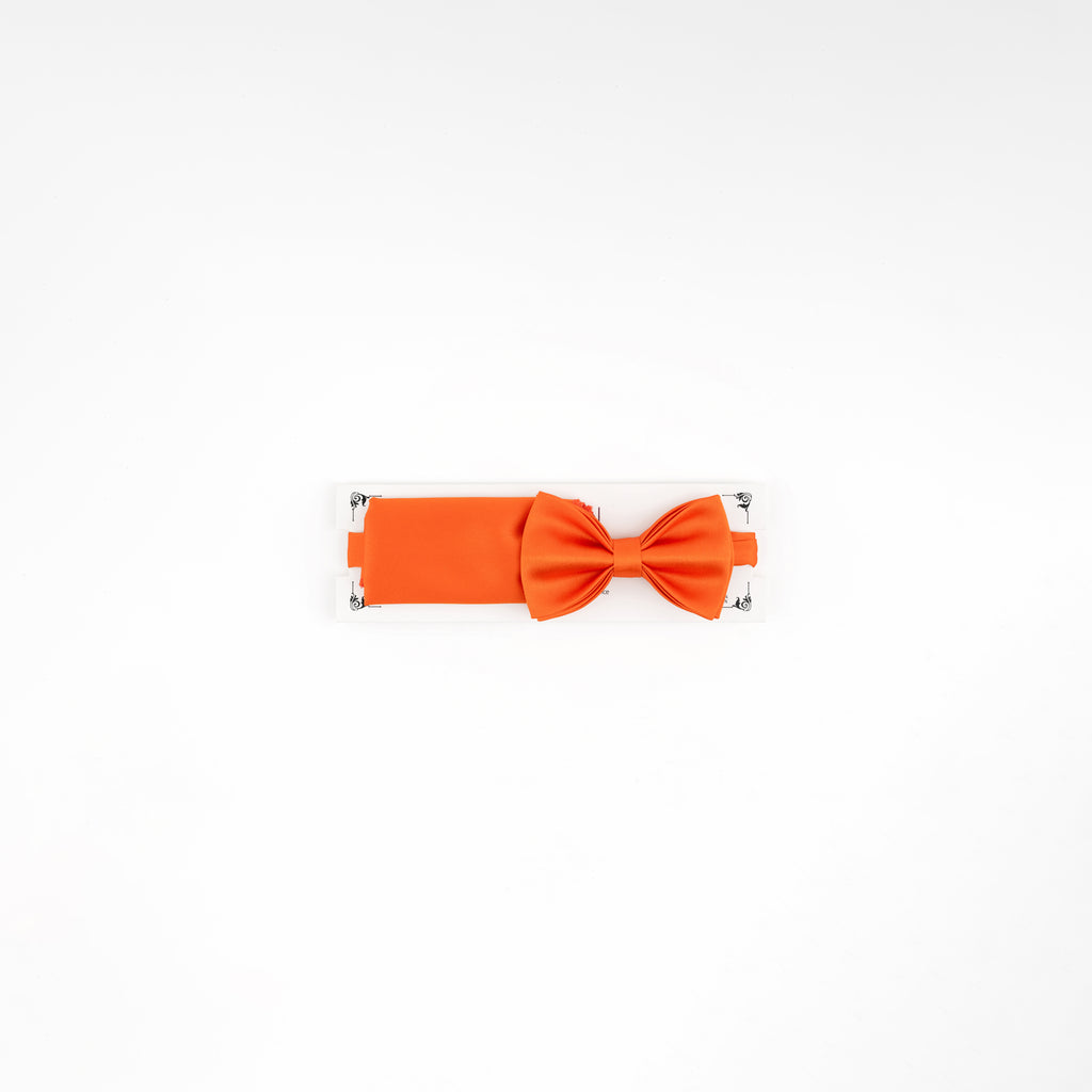 Orange bow tie on a white background
