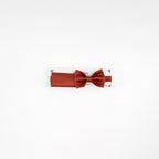 Red bow tie on a white background