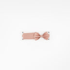 Pink bow belt on a white background