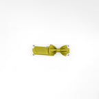 Green bow tie on a white background