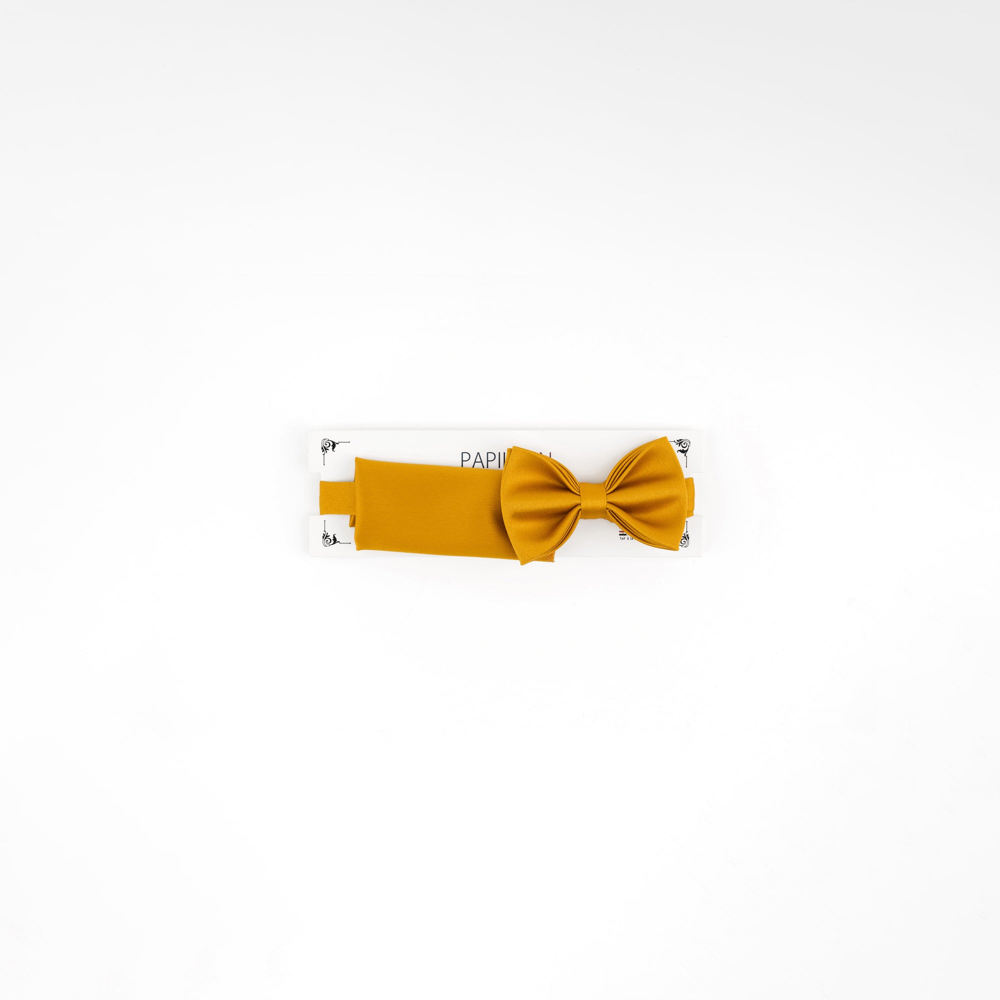 Mustard yellow bow tie on a white background