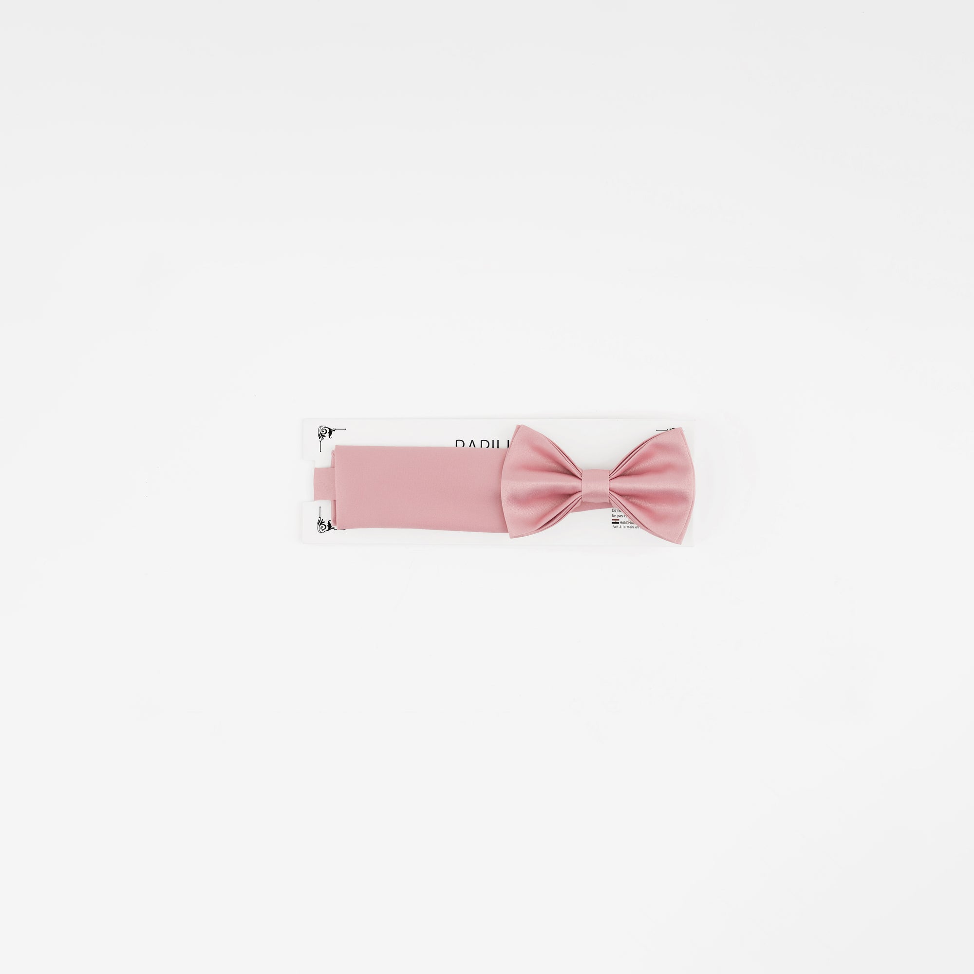 Pink bow tie on a white background